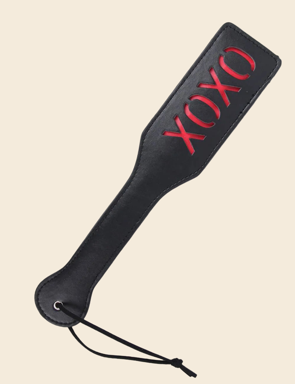 A black paddle with the word 'XOXO' printed in red. The paddle has a handle and a small leather strap for holding.